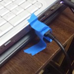 Taping cords to fix USB ports